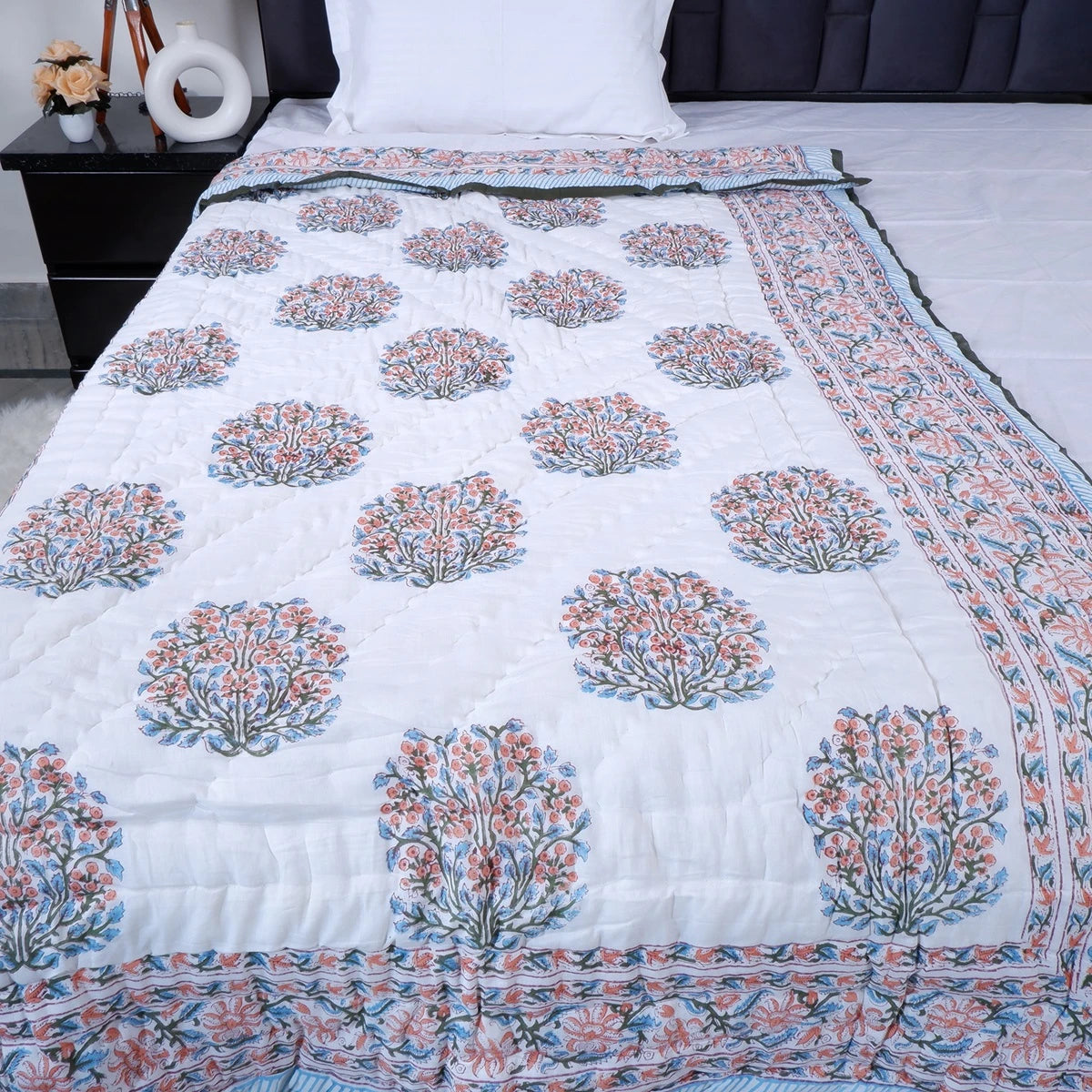 Jaipuri cotton quilt single bed in white with floral print and intricate border design